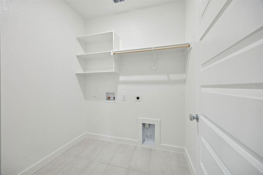 Utility Room in the Stanley II home plan by Trophy Signature Homes – REPRESENTATIVE PHOTO