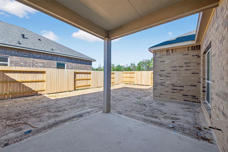 Exterior details and patio area of a home in Enclave at Willis, Willis (Image 23).