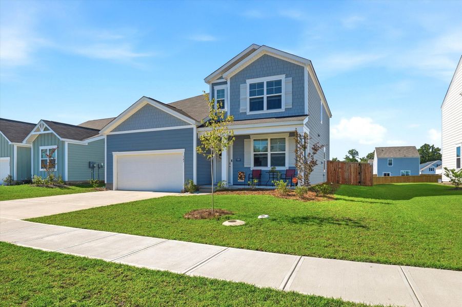 Front exterior of a new home in , Moncks Corner, SC, highlighting curb appeal (Image 28). Front exterior of a new home in , Moncks Corner, SC, highlighting curb appeal (Image 28).