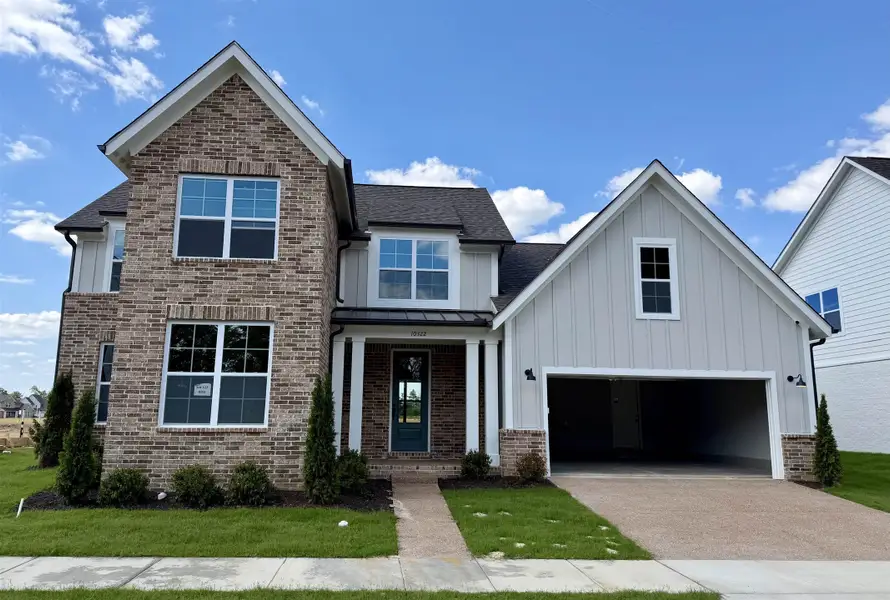 Front exterior of a new home in Lockwood, Collierville, TN, highlighting curb appeal (Image 1). Front exterior of a new home in Lockwood, Collierville, TN, highlighting curb appeal (Image 1).