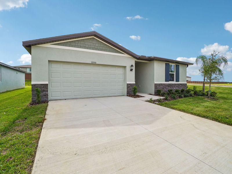 Front exterior of a new home in Hilltop Vistas, Dade City, FL, highlighting curb appeal (Image 2). Front exterior of a new home in Hilltop Vistas, Dade City, FL, highlighting curb appeal (Image 2).