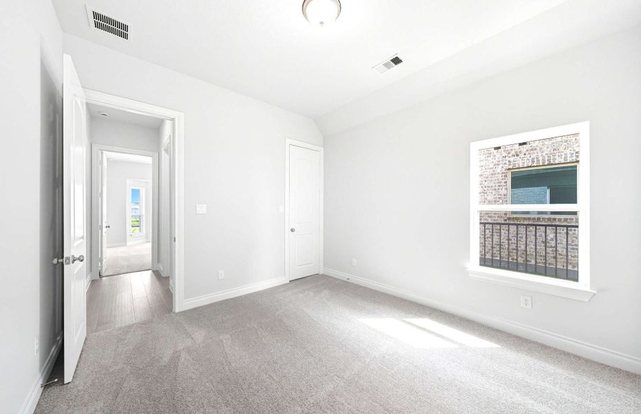 Representative unfurnished interior of a home built from the 3663 by Ravenna Homes in Artavia 70′, Conroe (Image 37).