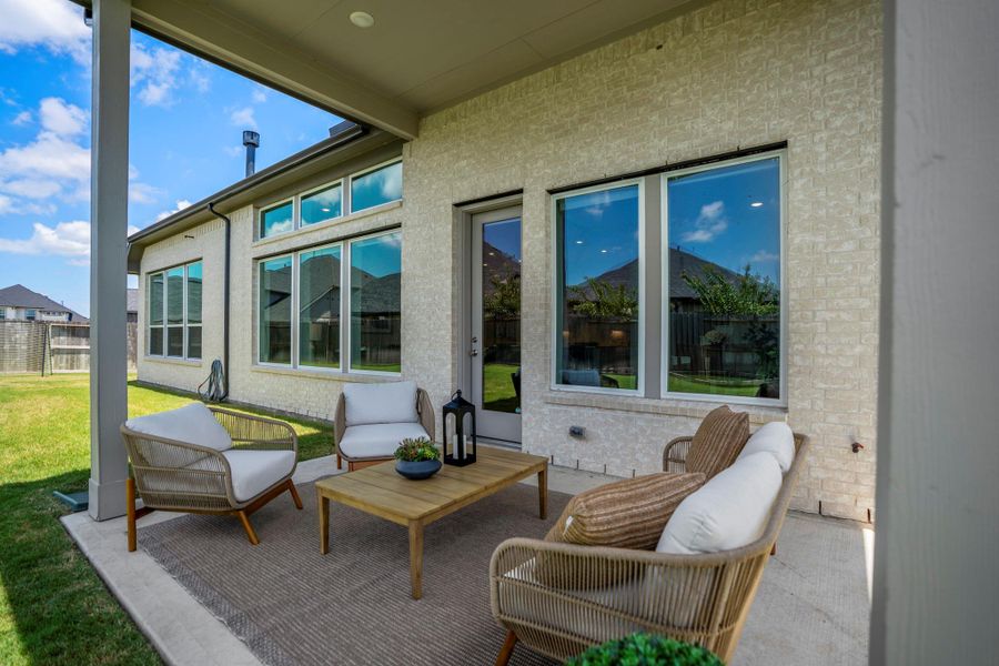 Step outside and settle into the shade of this inviting covered patio, where easy access from the dining area and family room makes outdoor meals, casual gatherings and everyday relaxation feel effortless.