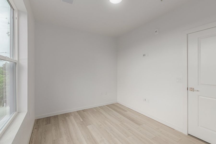 Spacious, unfurnished interior of a new home in The Scene at Sloan's Lake, Denver (Image 8).