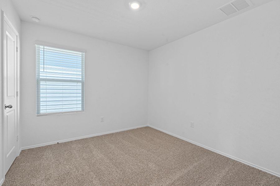 Carpeted empty room featuring baseboards and recessed lighting