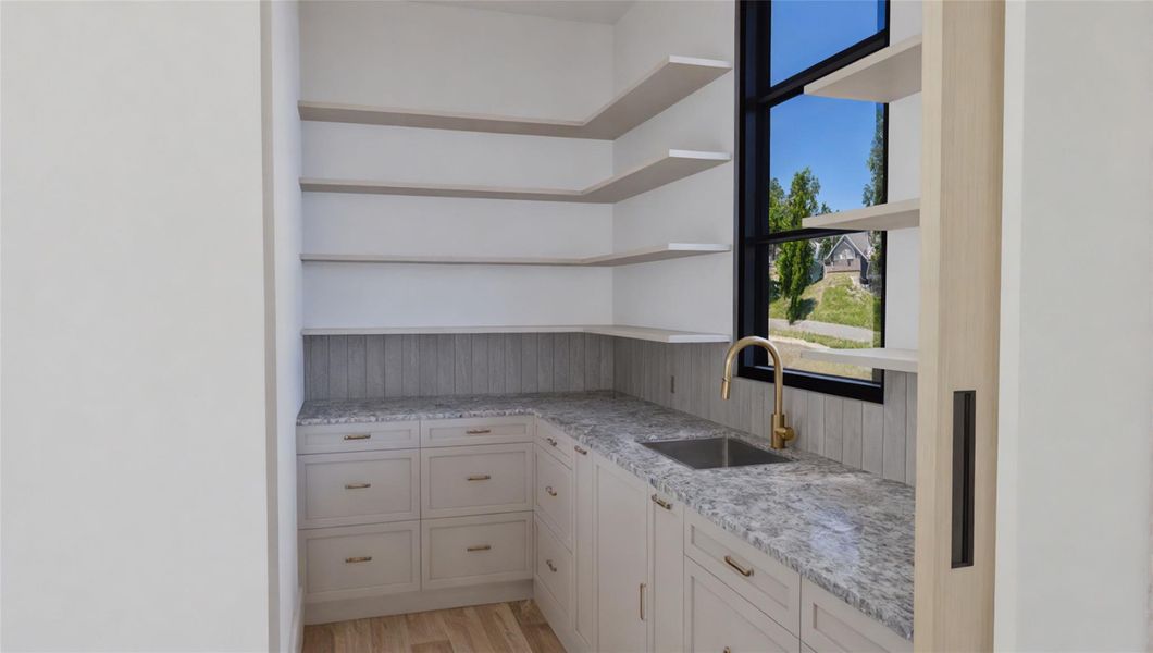 Spacious scullery-style kitchen—ideal for entertaining while keeping food prep and clean-up out of sight. Spacious scullery-style kitchen—ideal for entertaining while keeping food prep and clean-up out of sight.