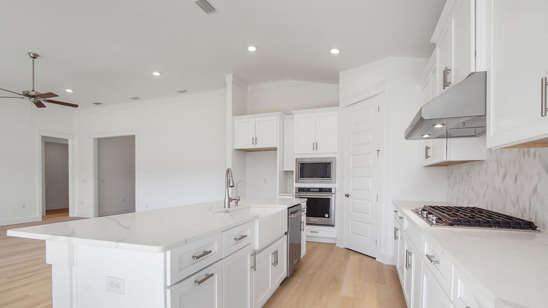 Representative furnished interior of a home built from the Camellia by D.R. Horton in Breakfast Point East Phase II, Panama City Beach (Image 7).