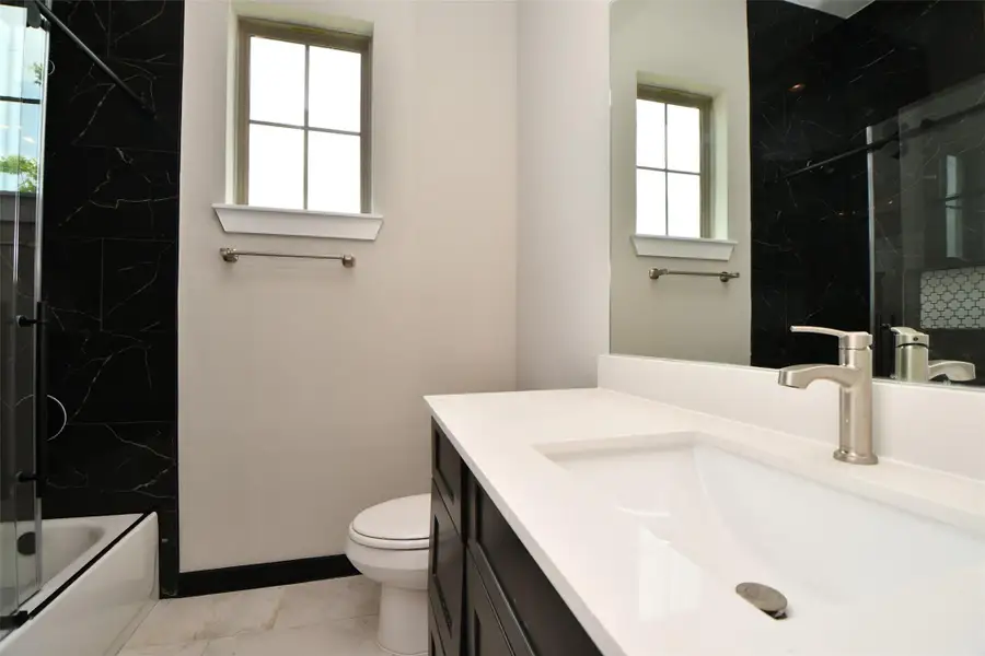 Secondary Bath large shower with floor to ceiling tiling. Secondary Bath large shower with floor to ceiling tiling.