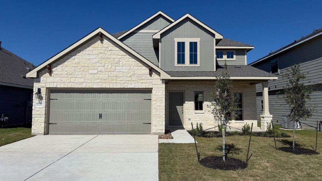 Front exterior of a new home in Southern Pointe, College Station, TX, highlighting curb appeal (Image 2).