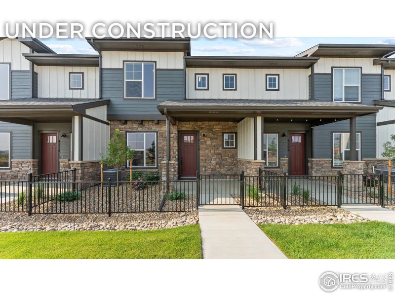 Front exterior of a new home in Highlands at Fox Hill - Discovery, Longmont, CO, highlighting curb appeal (Image 1).