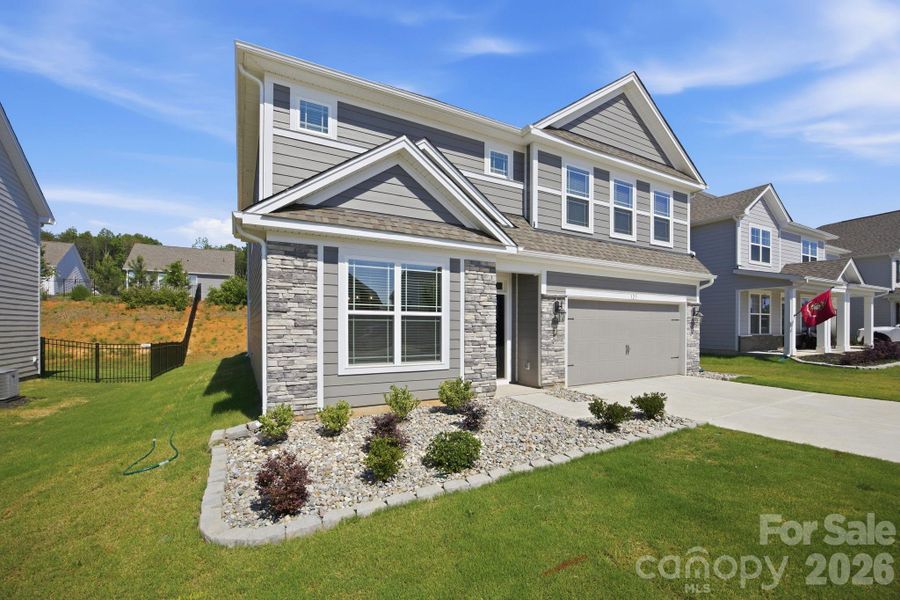Front exterior of a new home in Falls Cove, Troutman, NC, highlighting curb appeal (Image 24). Front exterior of a new home in Falls Cove, Troutman, NC, highlighting curb appeal (Image 24).
