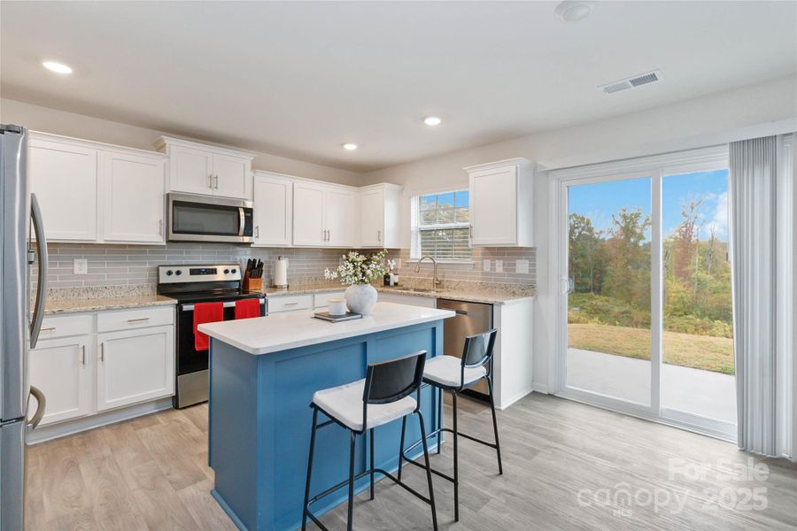 Kitchen with opening to the backyard
