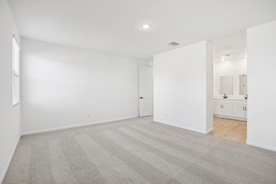 Primary suite. Finishes and options may vary by community
