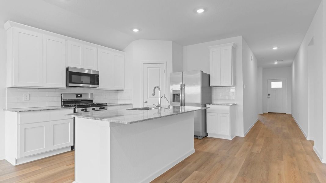 Furnished interior view inside a new home in Caldwell Crossing, Iowa Colony (Image 3).
