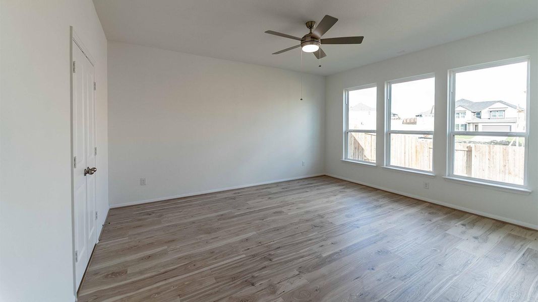 Spare room with light wood-style flooring and ceiling fan