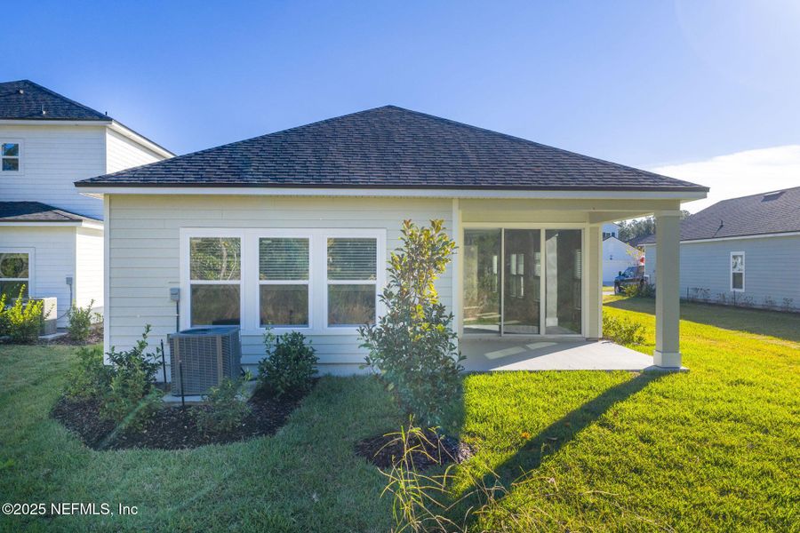 Exterior details and patio area of a home in Beacon Lake, St. Augustine (Image 4).