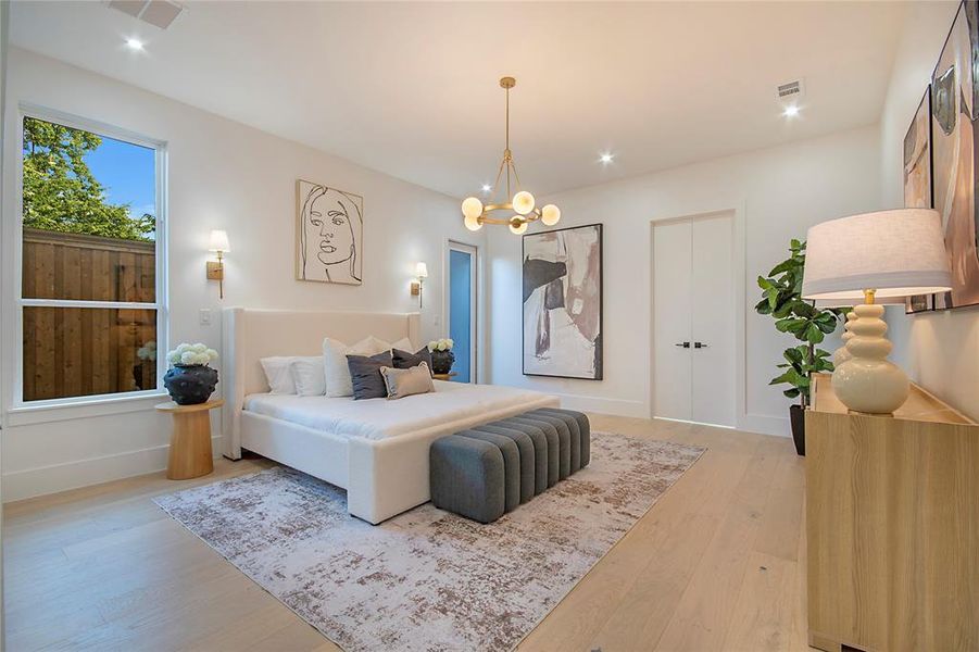 Bedroom featuring wood finished floors, a chandelier, and recessed lighting Bedroom featuring wood finished floors, a chandelier, and recessed lighting
