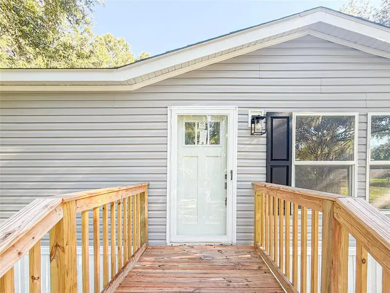 Exterior details and patio area of a home in , Polk City (Image 15).