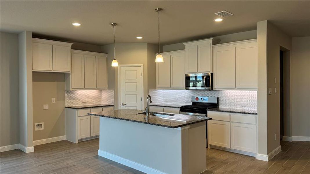 Kitchen - All Home and community information, including pricing, included features, terms, availability and amenities, are subject to change at any time without notice or obligation. All Drawings, pictures, photographs, video, square footages, floor plans, elevations, features, colors and sizes are approximate for illustration purposes only and will vary from the homes as built. Kitchen - All Home and community information, including pricing, included features, terms, availability and amenities, are subject to change at any time without notice or obligation. All Drawings, pictures, photographs, video, square footages, floor plans, elevations, features, colors and sizes are approximate for illustration purposes only and will vary from the homes as built.