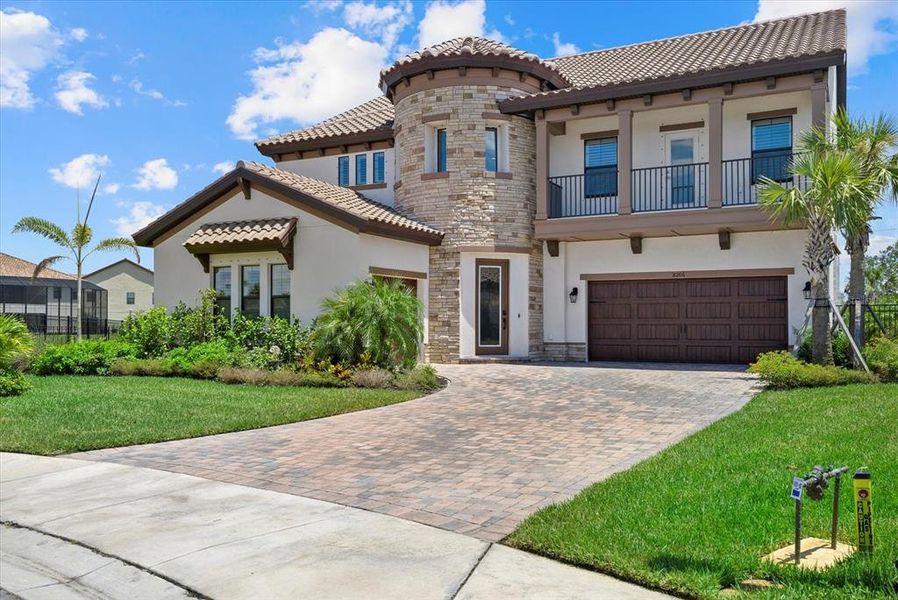 Front exterior of a new home in Crosswind Ranch, Parrish, FL, highlighting curb appeal (Image 26).