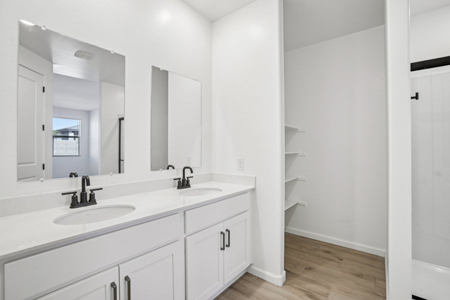 Primary suite. Finishes and options may vary by community
