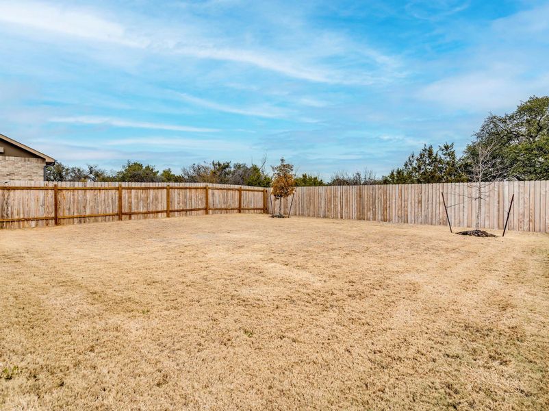 Tucked away on an oversized lot, this home offers ultimate privacy with a greenbelt backdrop and no neighbors on the right or behind