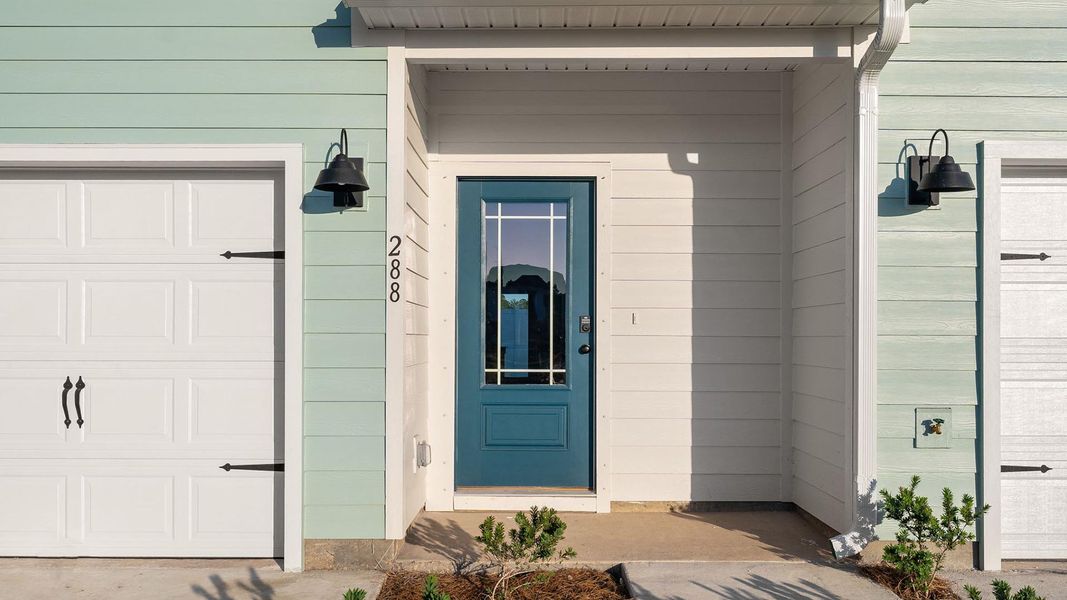 Exterior details and patio area of a home in Colonial East Townhomes, Panama City Beach (Image 2).