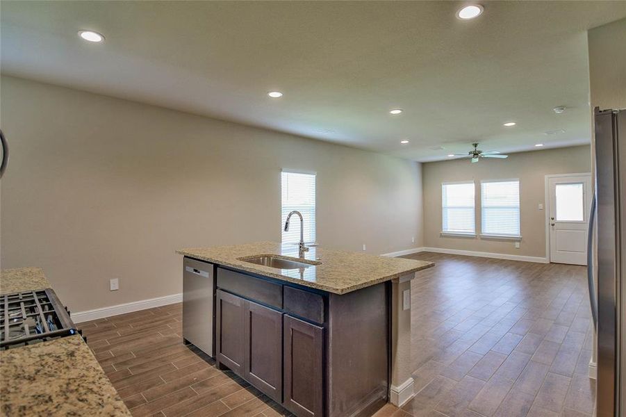 Kitchen featuring dark wood-style flooring, dark brown cabinetry, recessed lighting, appliances with stainless steel finishes, and ceiling fan Kitchen featuring dark wood-style flooring, dark brown cabinetry, recessed lighting, appliances with stainless steel finishes, and ceiling fan
