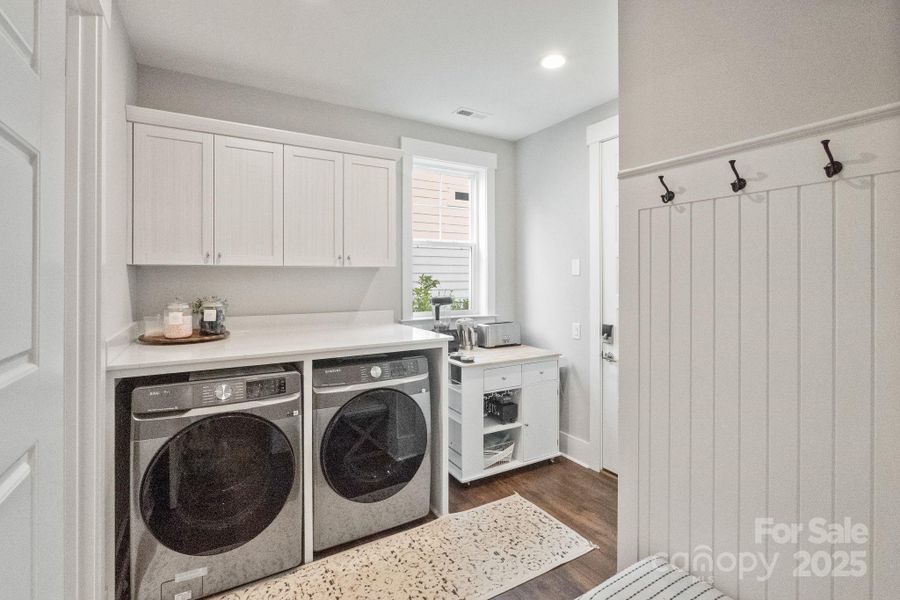 Just inside the house from the garage is the laundry room, coat closet (large, walk-in) and a drop zone for all your stuff!