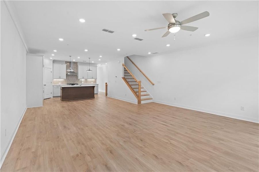 The kitchen anchors the space with its stylish finishes and functional design, ensuring a smooth flow between cooking, dining, and relaxation.