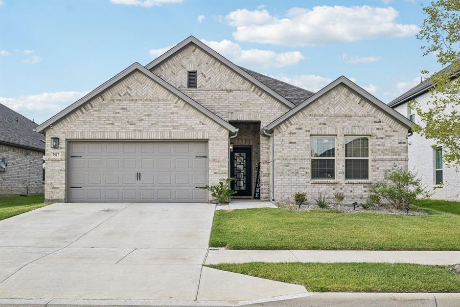 Front exterior of a new home in , Venus, TX, highlighting curb appeal (Image 1).