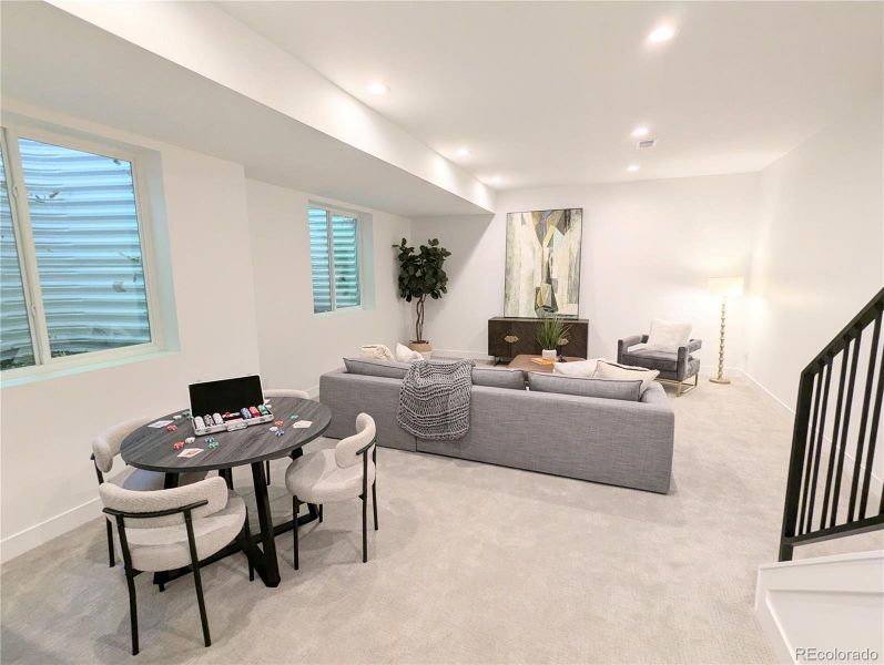 Basement rec room with soaring ceilings