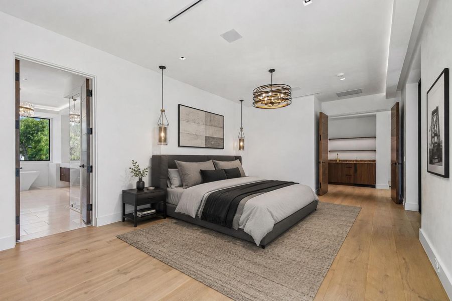 Virtually staged primary bedroom. Smooth plaster walls and rich hardwood flooring define this tranquil third-level bedroom suite. Virtually staged primary bedroom. Smooth plaster walls and rich hardwood flooring define this tranquil third-level bedroom suite.