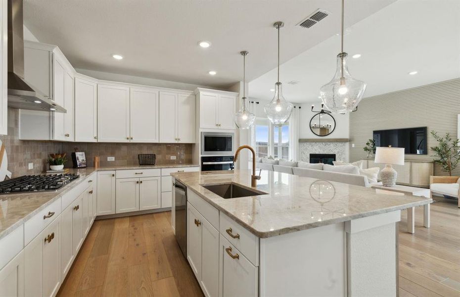 *actual home, furniture not included - Large island overlooking gathering room and dining areas