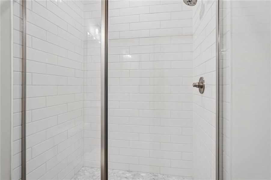 Ensuite bathroom featuring Artic white tiled shower stall, staggered pattern.