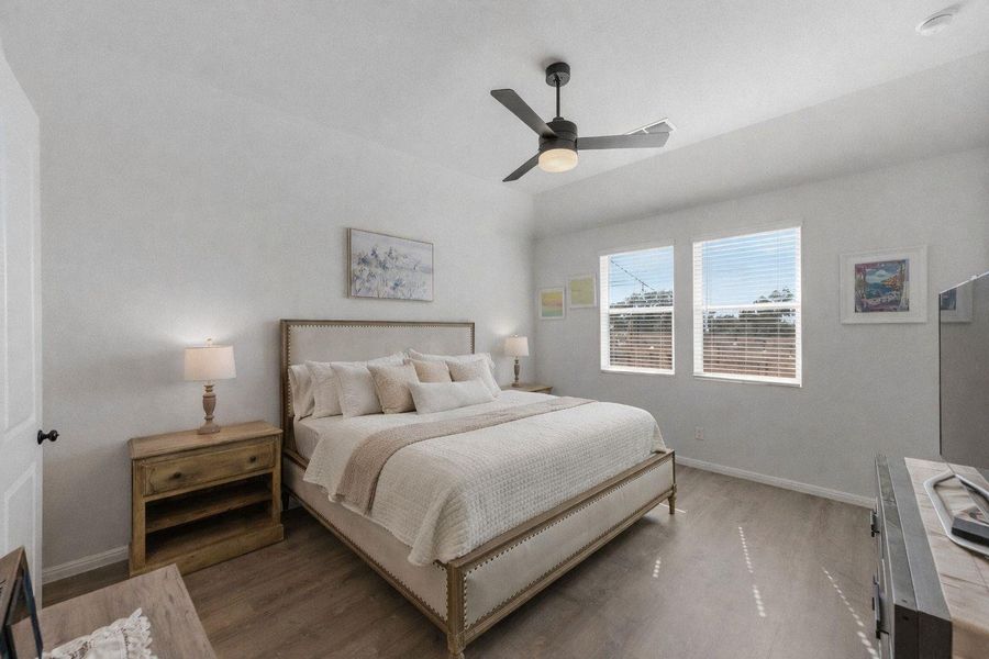 Bedroom featuring wood finished floors and ceiling fan