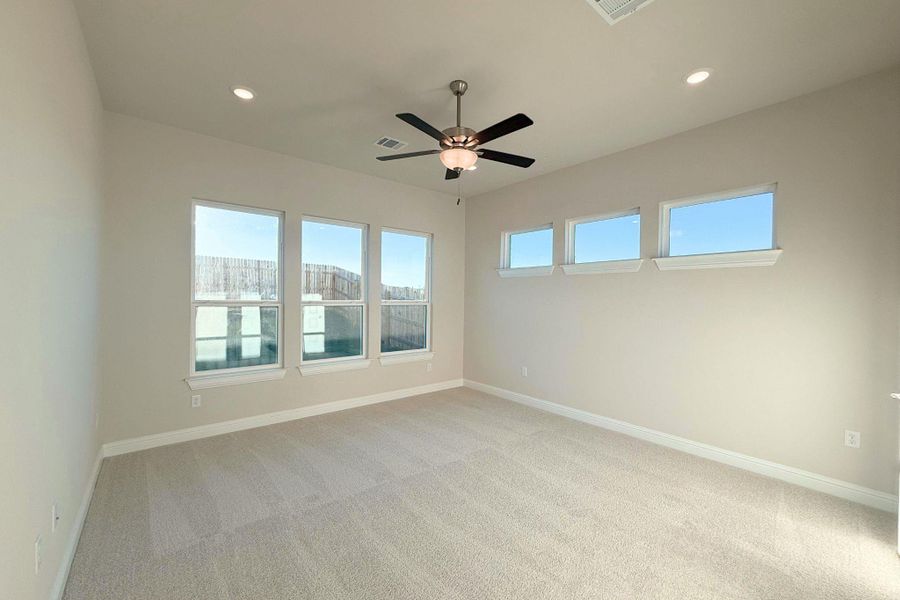 Unfurnished room with light colored carpet, ceiling fan, and recessed lighting