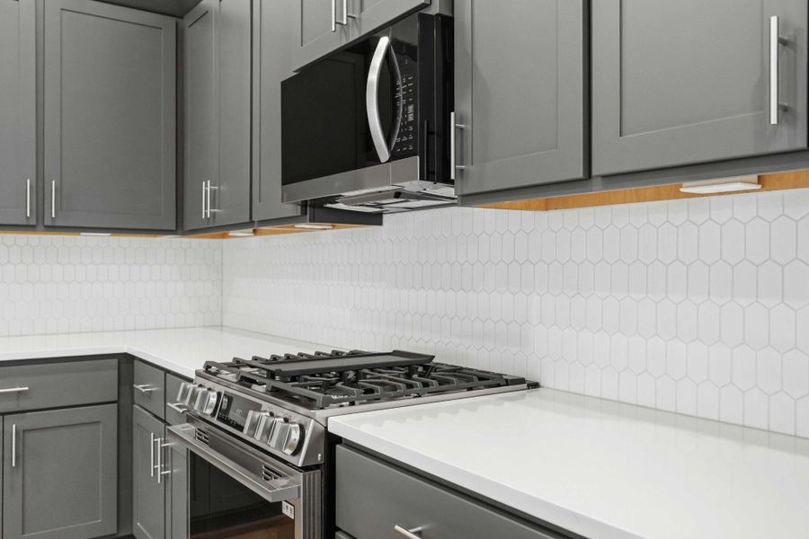 Cooking Made Easy. The gourmet kitchen boasts stainless steel appliances, a gas cooktop, and elegant designer finishes.