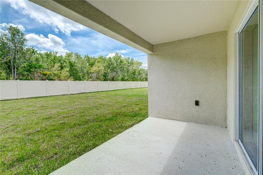 Exterior details and patio area of a home in Crosswind Point, Parrish (Image 3).