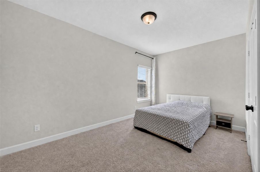 Upstairs Bedroom 2: With its generous layout and clean, contemporary design, this upstairs secondary bedroom offers a welcoming atmosphere that easily adapts to your needs. Whether used as a private bedroom or a comfortable guest retreat, it provides a peaceful space to relax and recharge.