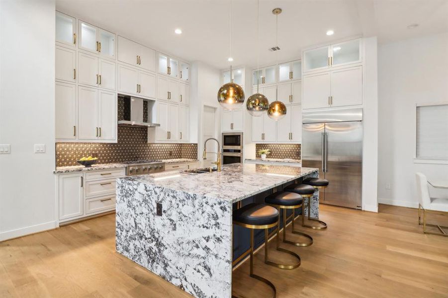 Brilliantly designed kitchen with a waterfall feature on the island counters.