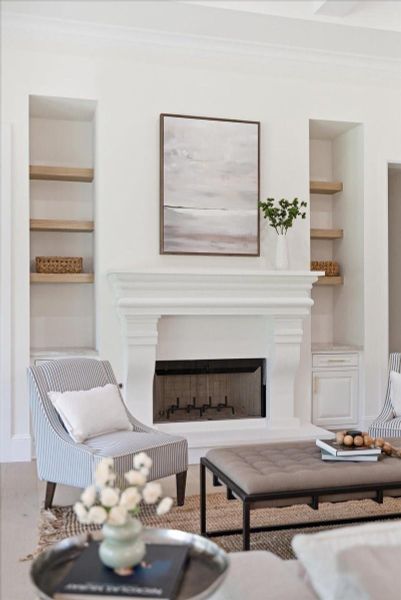 The living room has that rare feeling of being both grand and deeply comfortable, the kind of space where people settle in, stay awhile, and make memories without trying.