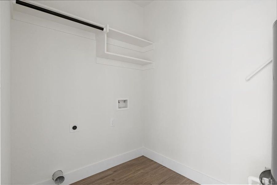 Laundry area featuring hookup for a washing machine, hardwood / wood-style floors, and hookup for an electric dryer