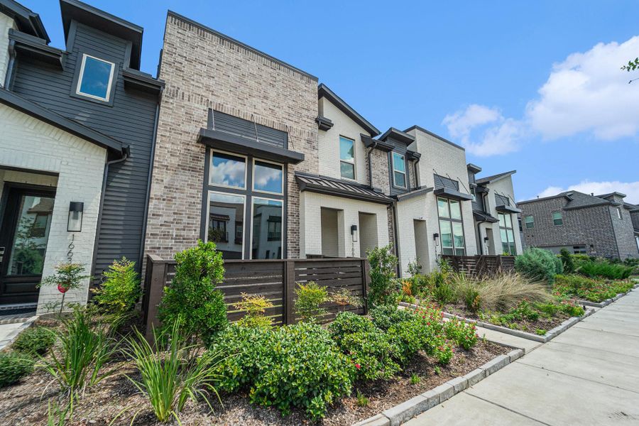 View of Southbridge townhomes with walkable sidewalks and well-kept landscaping.