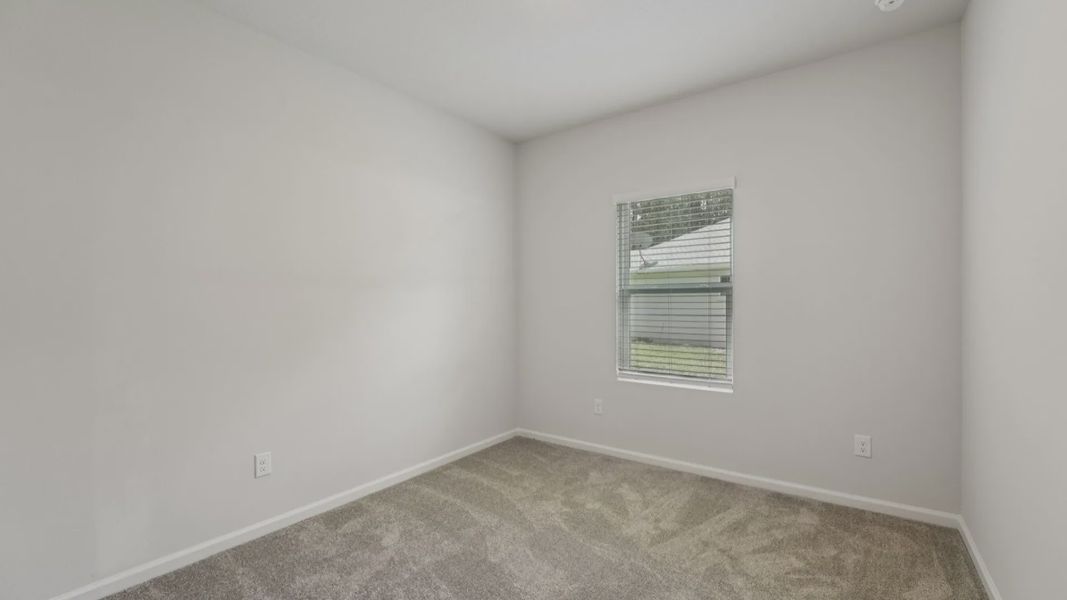 Luxurious plush carpeting complements the serene, light-filled ambiance of this Palm Coast residence.