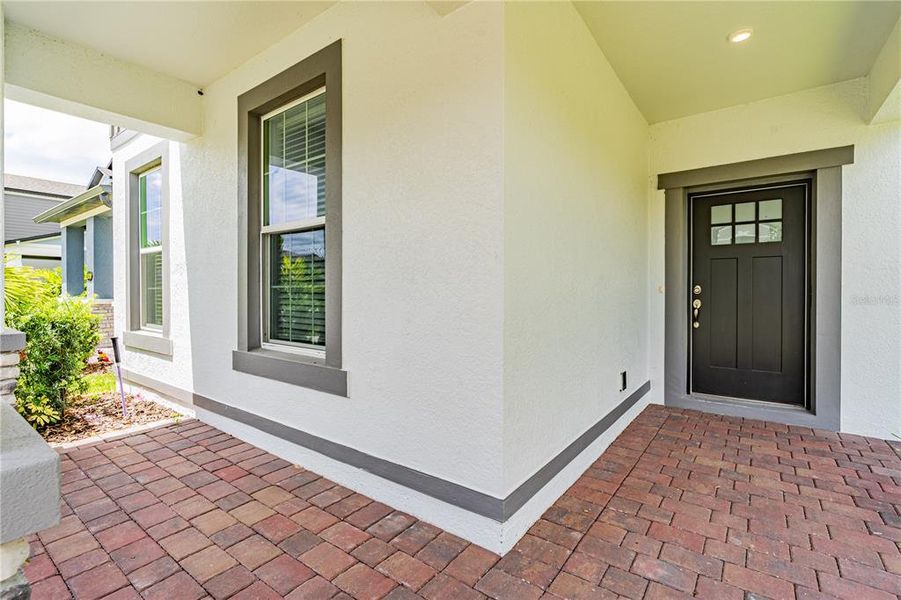 Front exterior of a new home in Encore at Ovation, Winter Garden, FL, highlighting curb appeal (Image 23).