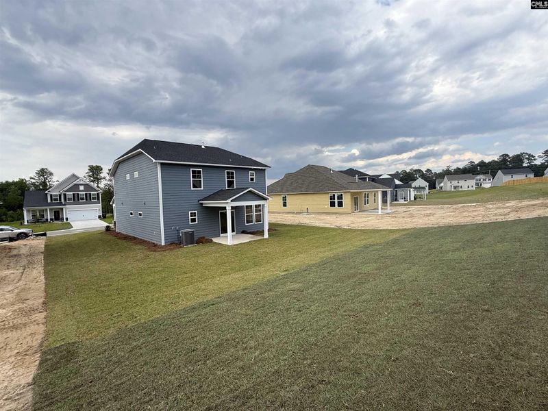 Exterior details and patio area of a home in Cottages at Roofs Pond, West Columbia (Image 25).
