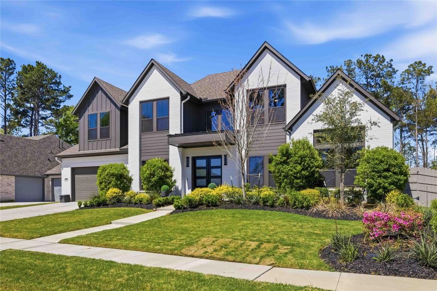 Front exterior of a new home in Artavia, Conroe, TX, highlighting curb appeal (Image 2).