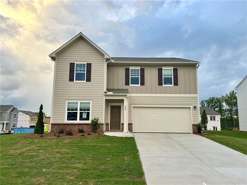 Front exterior of a new home in Mt. Tabor Ridge, Dallas, GA, highlighting curb appeal (Image 1). Front exterior of a new home in Mt. Tabor Ridge, Dallas, GA, highlighting curb appeal (Image 1).