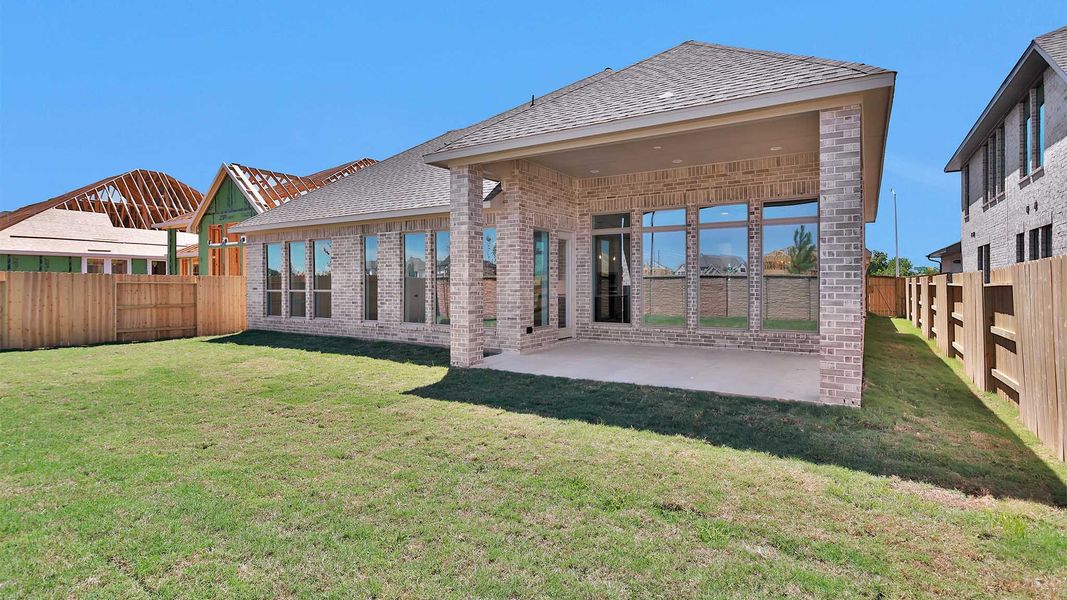 Exterior details and patio area of a home in Lakes of Cane Island, Katy (Image 3).